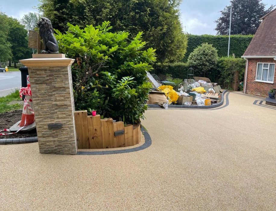 Gold resin drive with a stone pier