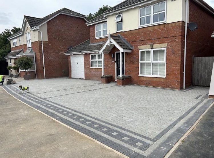 Block paved driveway with charcoal border detail